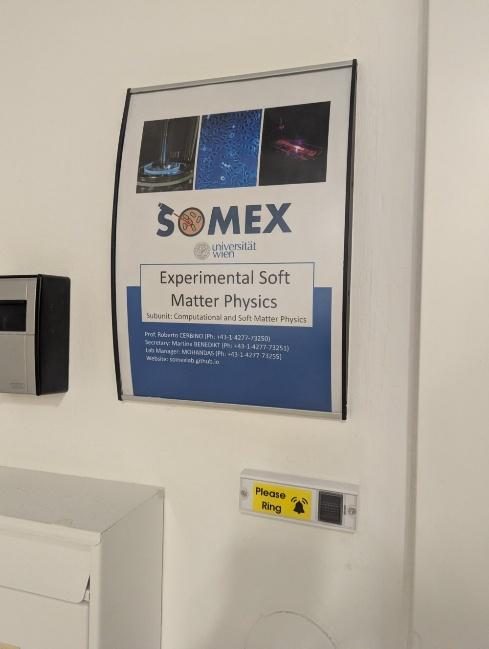 SoMeX poster and doorbell next to the entrance